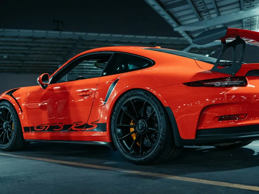 Orange Porsche 911 GT3 RS supercar, side profile